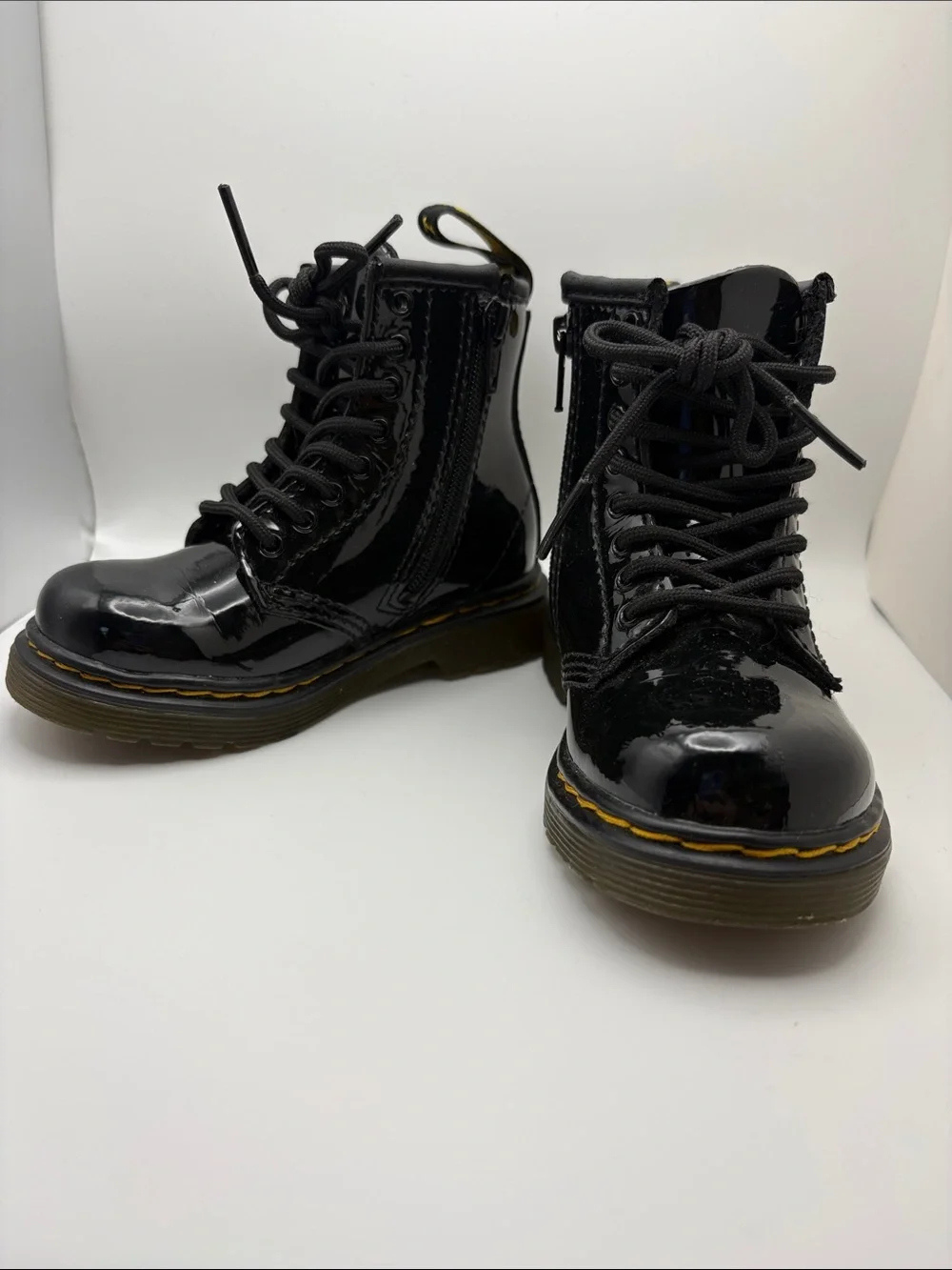 Dr. Martens Kids Glossy Black Patent Lace-Up Boots with Yellow Stitching